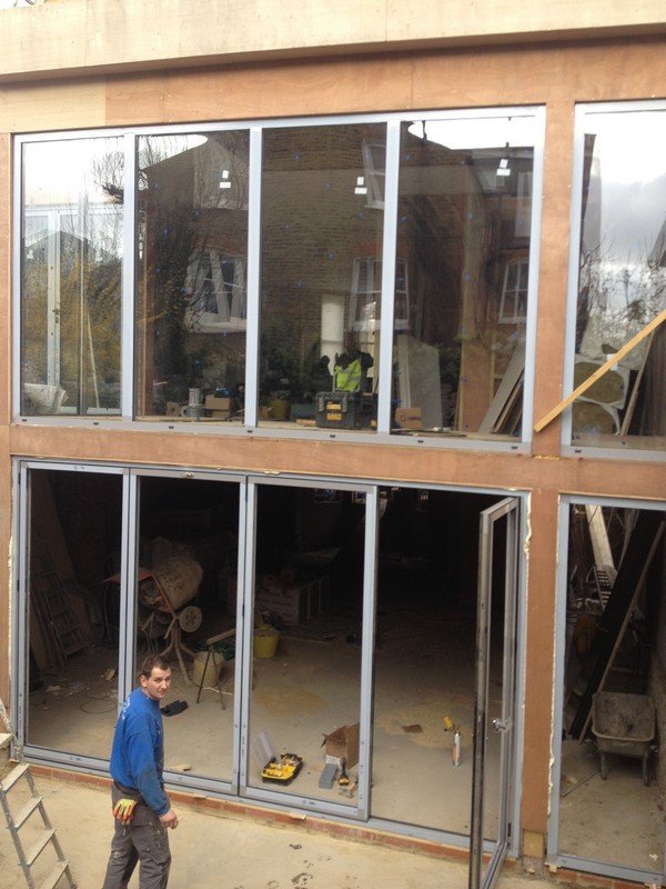 Aluminium bi-fold doors with two-storey glazing in Highgate
