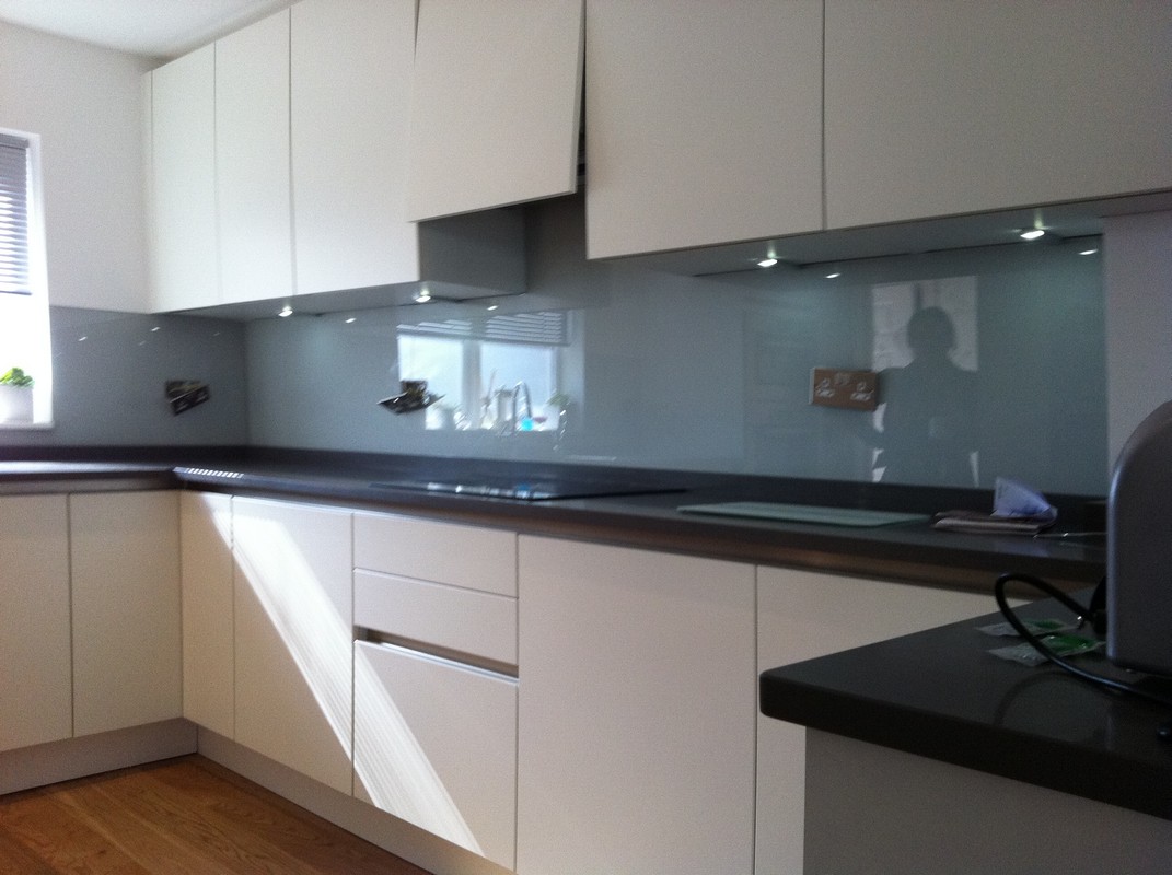 Grey glass kitchen splashback with LED lighting in Highgate