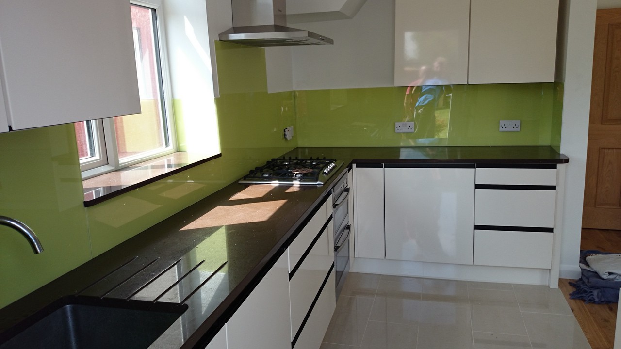 Lime green glass kitchen splashback installed by Highgate glaziers