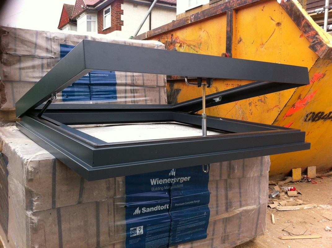 Opening flat roof skylight in anthracite grey installed in Highgate